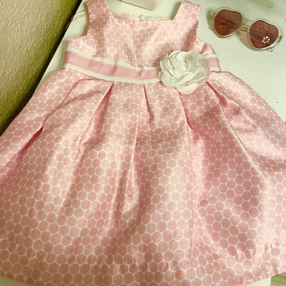 Pink polka dot toddler dress with accent flower